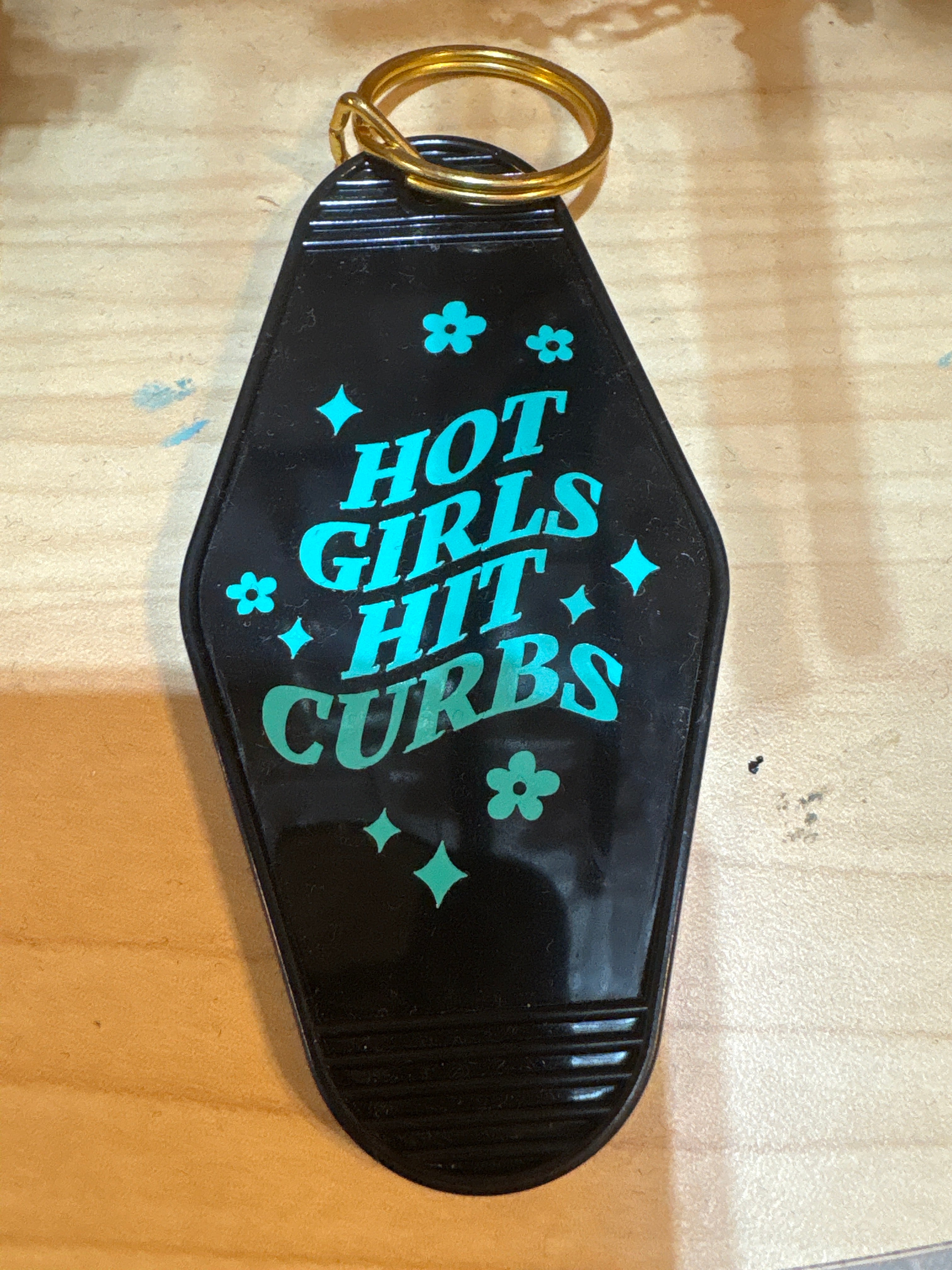 Hot girls hit curb keychain